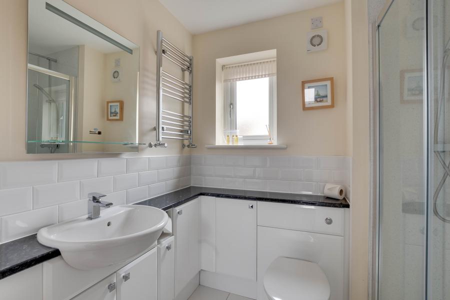 Ground floor shower room with walk in shower, basin and WC