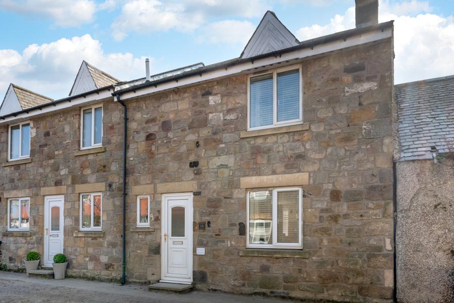 Stone exterior of Braidcarr Cottage in Seahouses