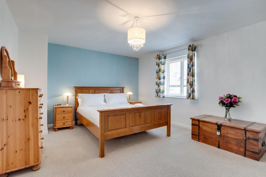 King size bedroom with wooden furniture