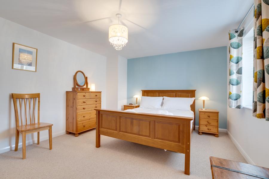 King size bedroom with dressing table and mirror
